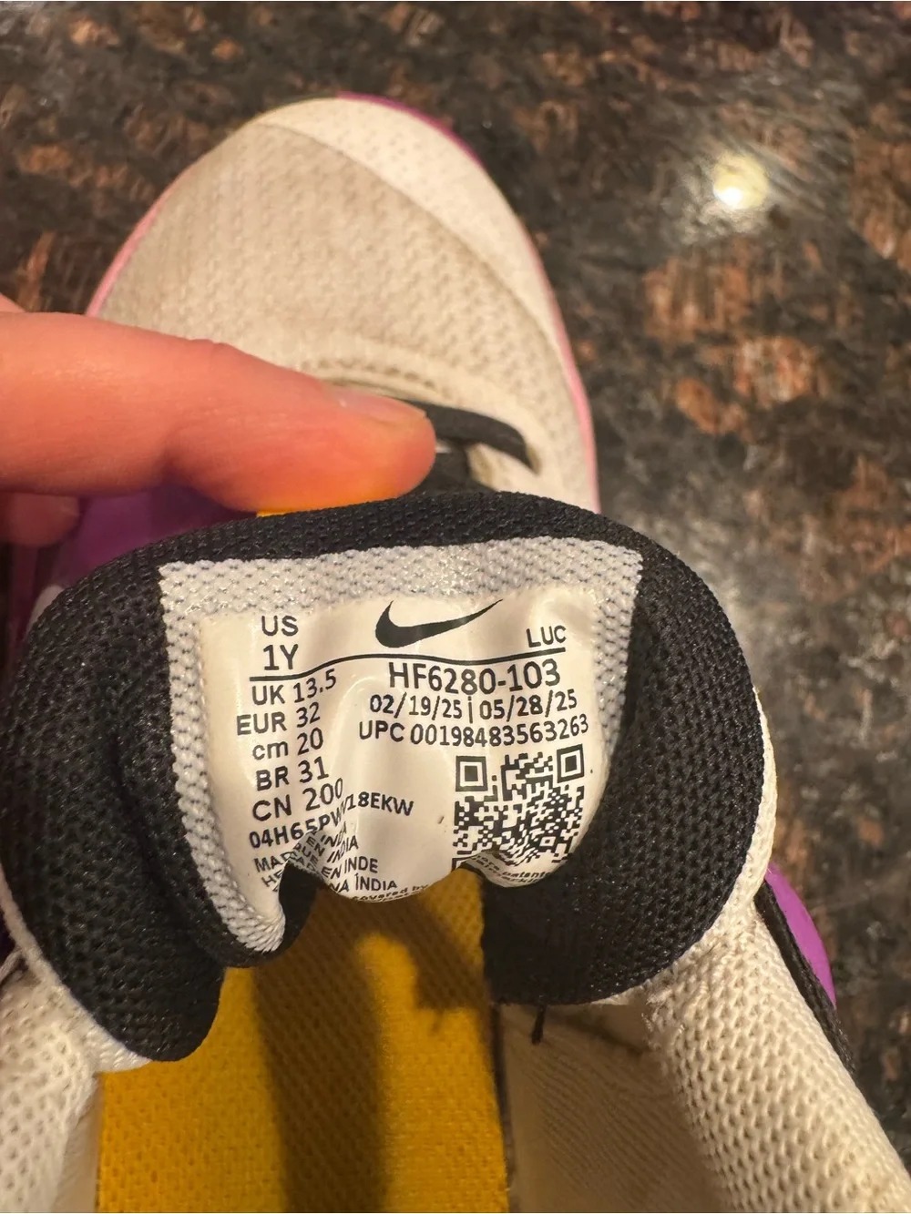 Nike Kids White basketball sneakers with Pink and Purple Accents